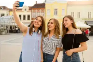 Pros and Cons of Solo vs Group Travel: What’s Right for You? 4 “Group of friends supporting each other”